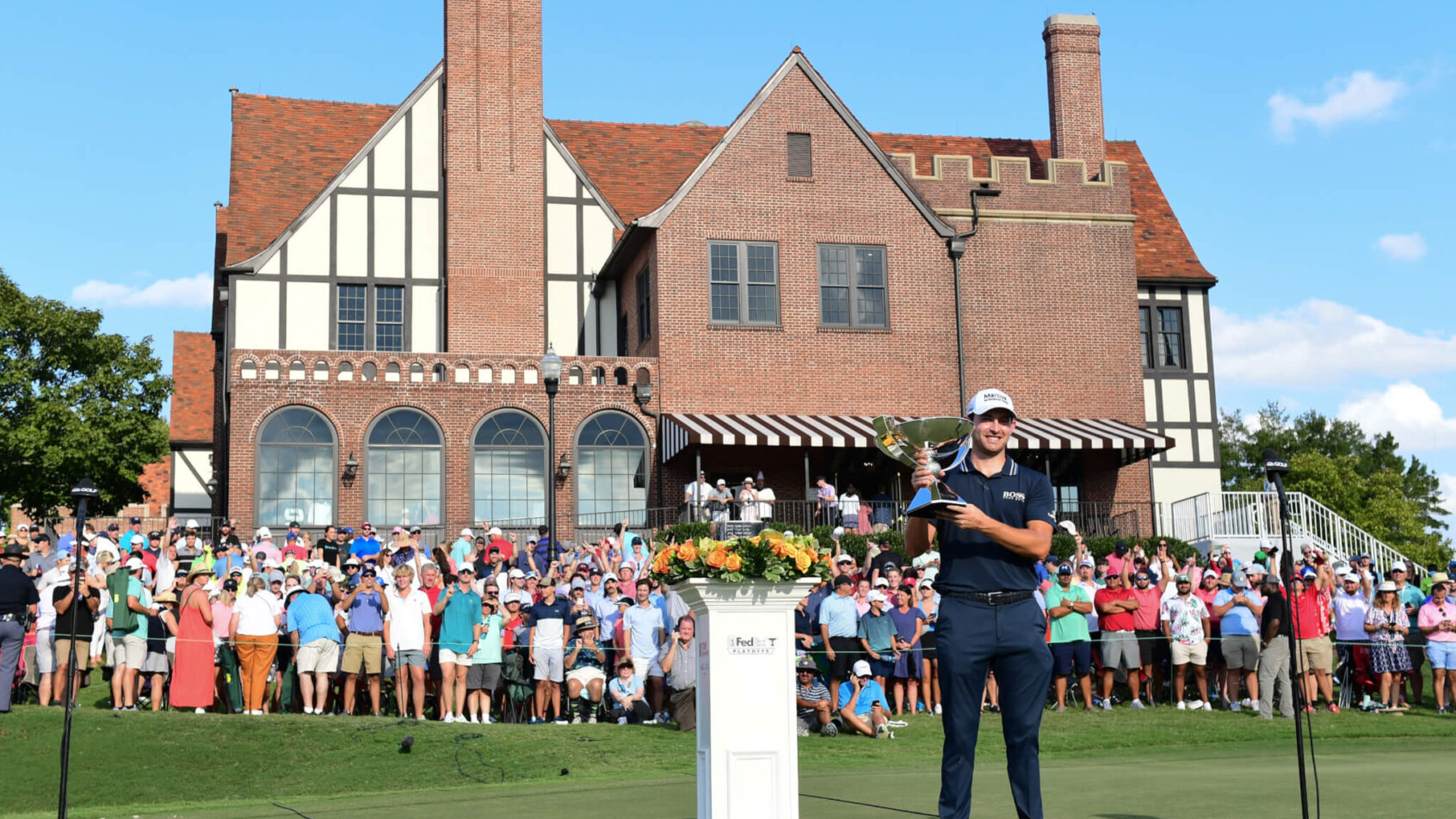 Patrick Cantlay holds up the trophy after winning the 2021 Tour Championship
