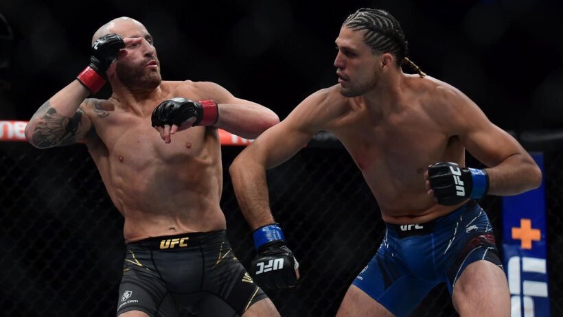 Brian Ortega throwing a punch at Alexander Volkanovski