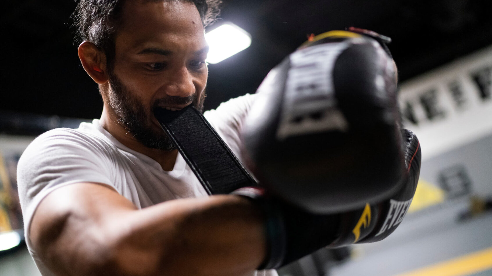 Benson Henderson strapping on his training gloves