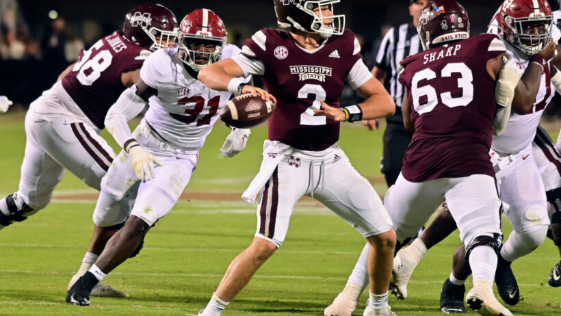 Mississippi State Bulldogs quarterback Will Rogers throws a pass against Alabama Crimson Tide linebacker Will Anderson Jr.