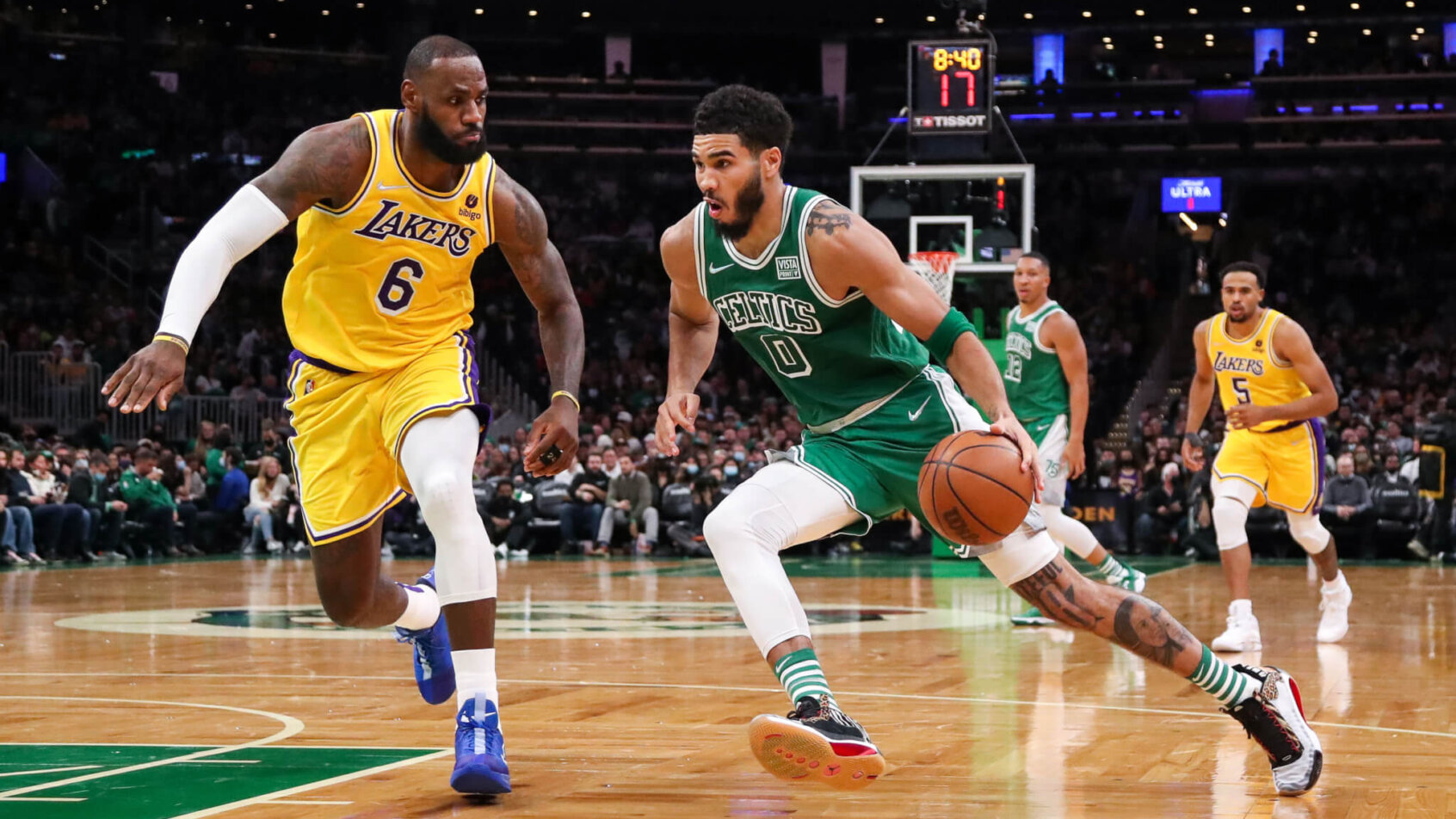 Jayson Tatum driving against LeBron James