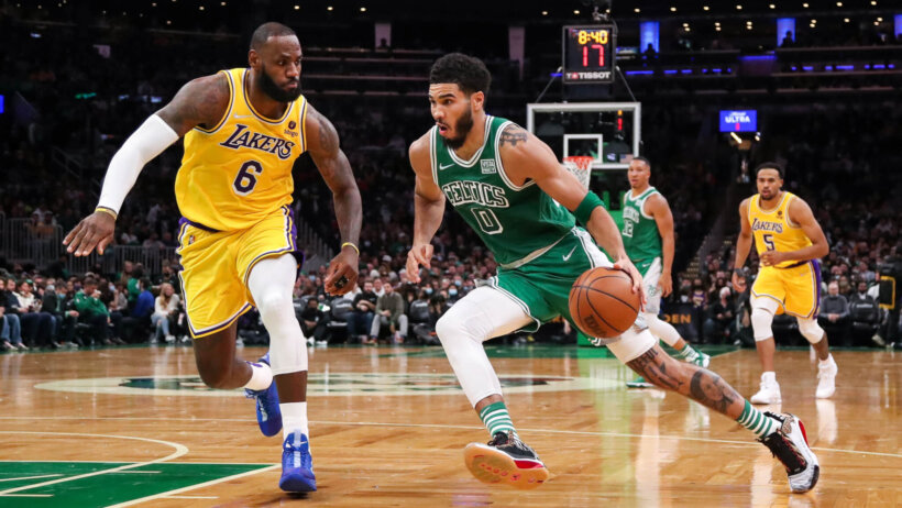 Jayson Tatum driving against LeBron James