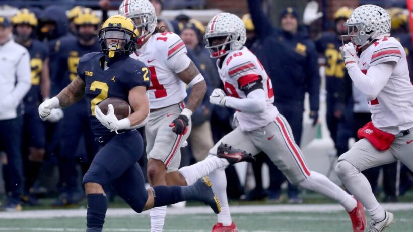Michigan Wolverines running back Blake Corum runs for a first down