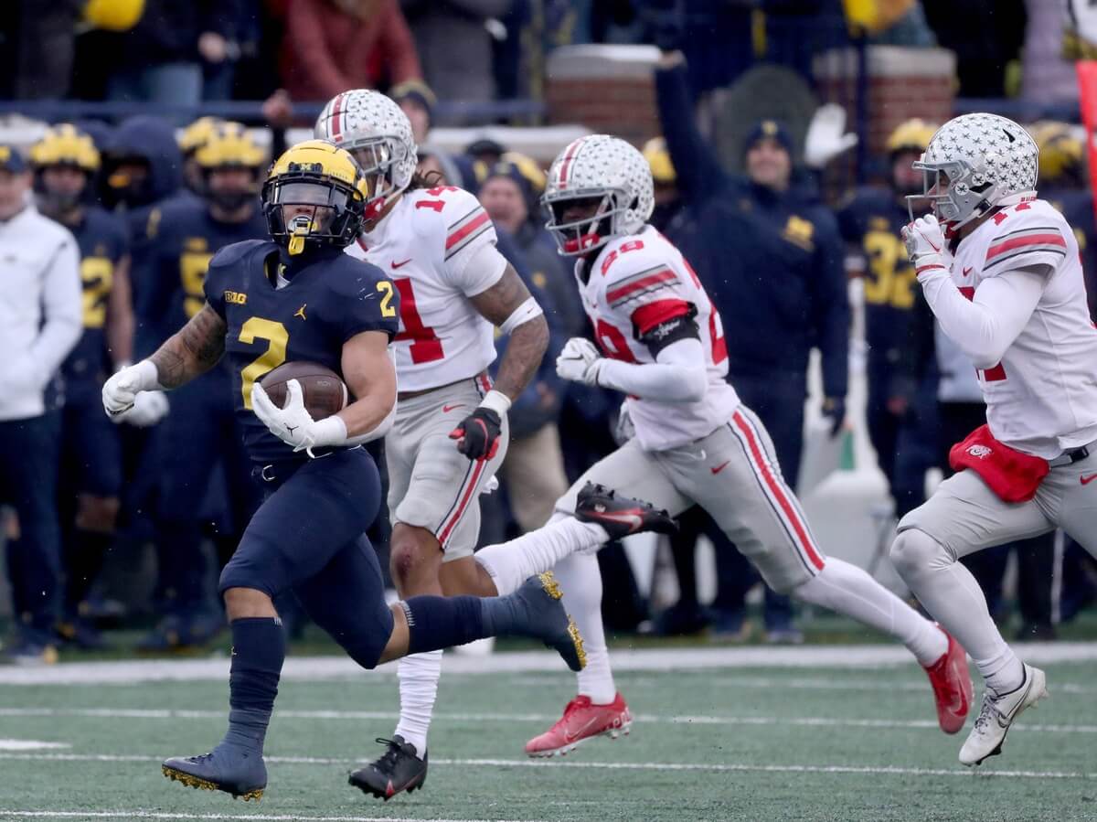 Michigan Wolverines running back Blake Corum runs for a first down