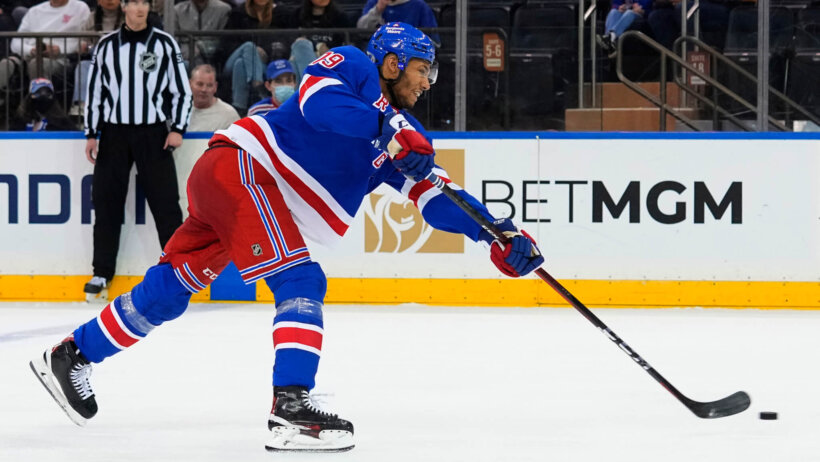K'Andre Miller NY Rangers shooting hockey puck