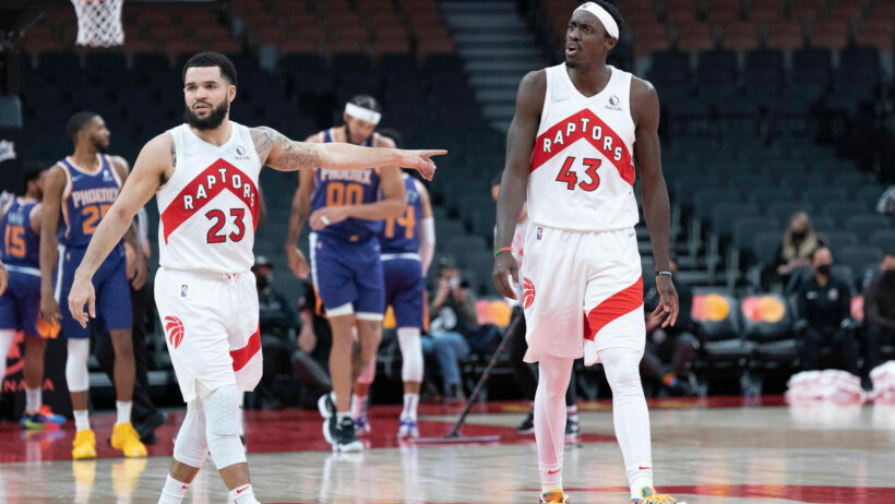 Toronto Raptors forward Pascal Siakam and guard Fred VanVleet reacting to a call during a game.
