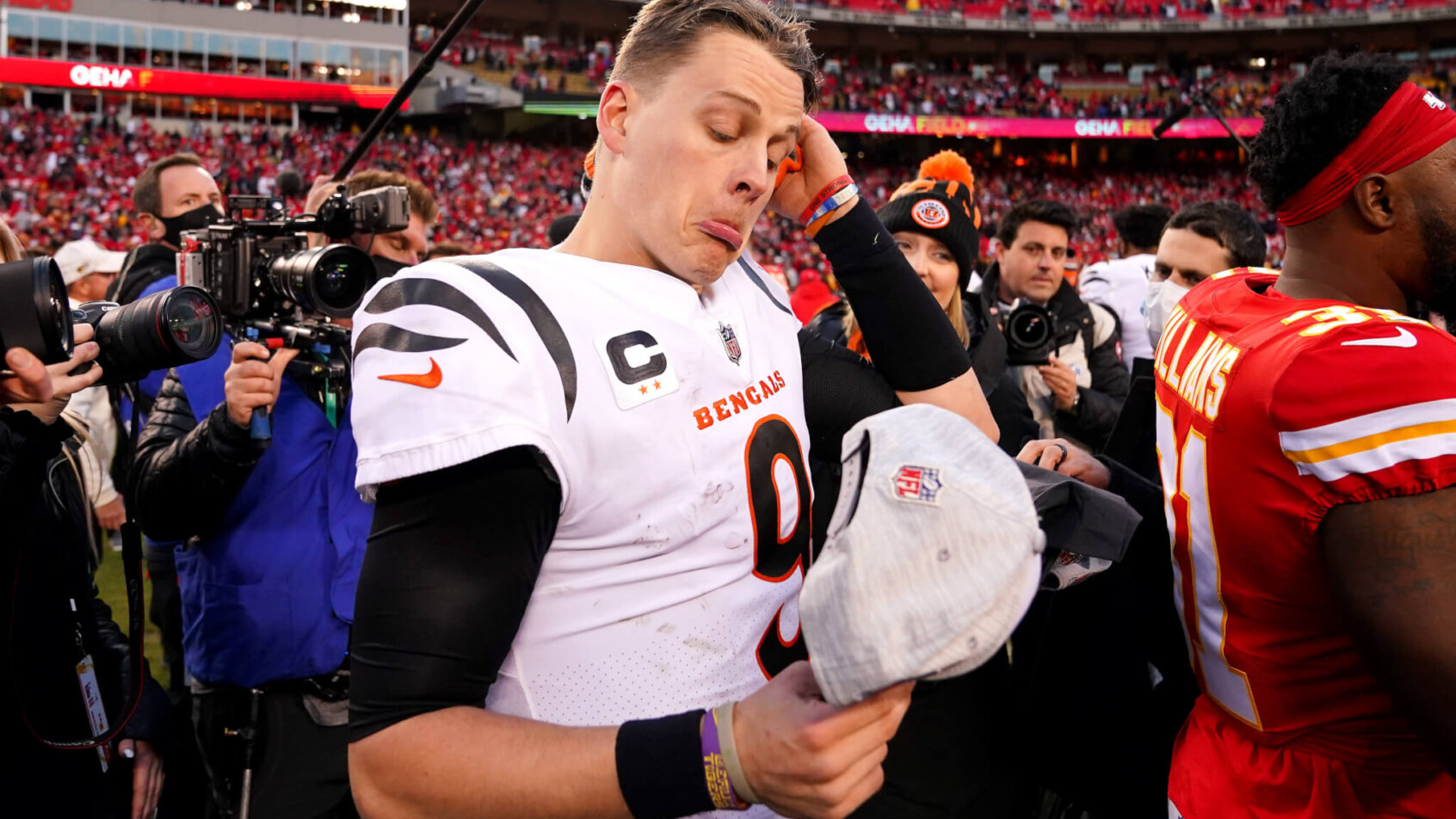 Joe Burrow studies his AFC Champions hat.