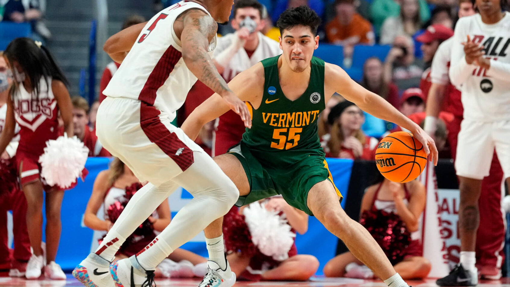 Vermont Catamounts guard Robin Duncan dribbling