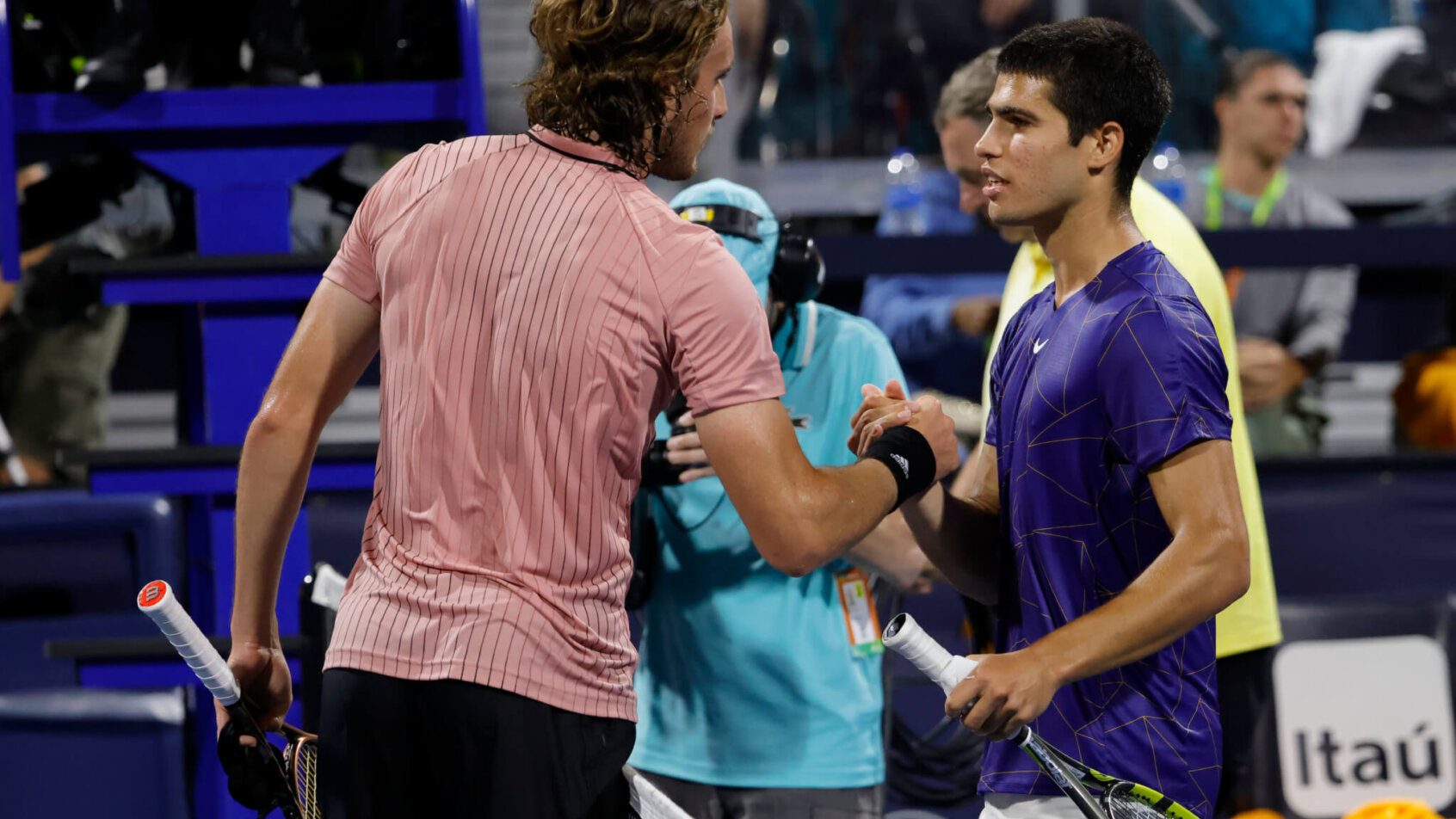 Carlos Alcaraz shakes hands with Stefanos Tsitsipas