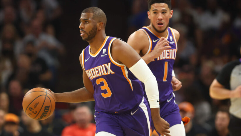 Chris Paul dribbling, Devin Booker running behind