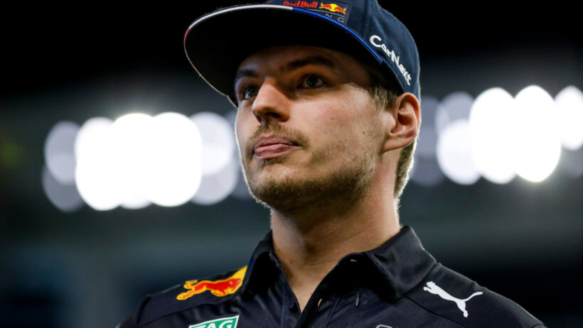 Max Verstappen watches from the field prior to throwing the ceremonial first pitch at a Miami Marlins game