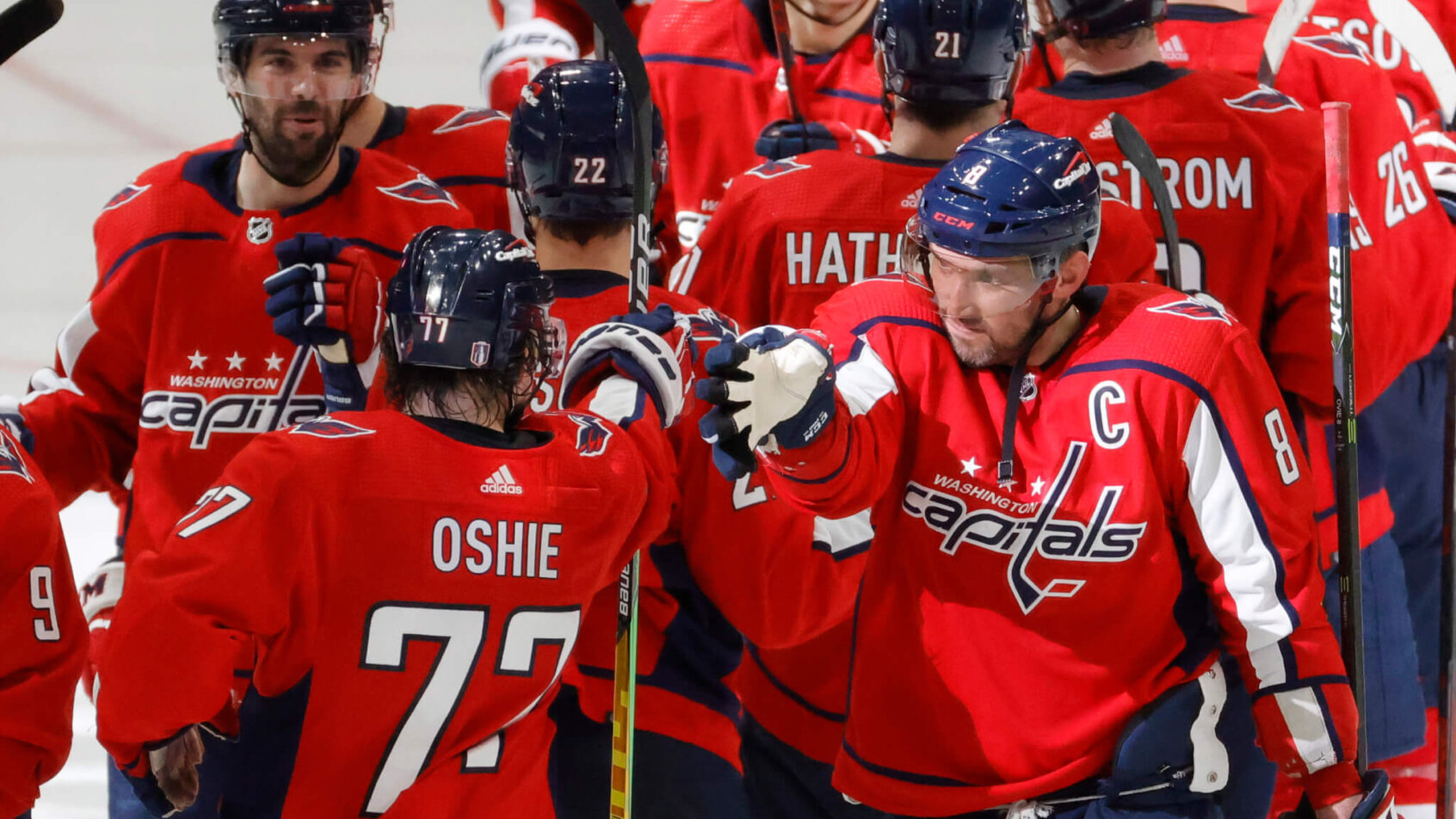 Washington Capitals players celebrating a playoff win over the Florida Panthers