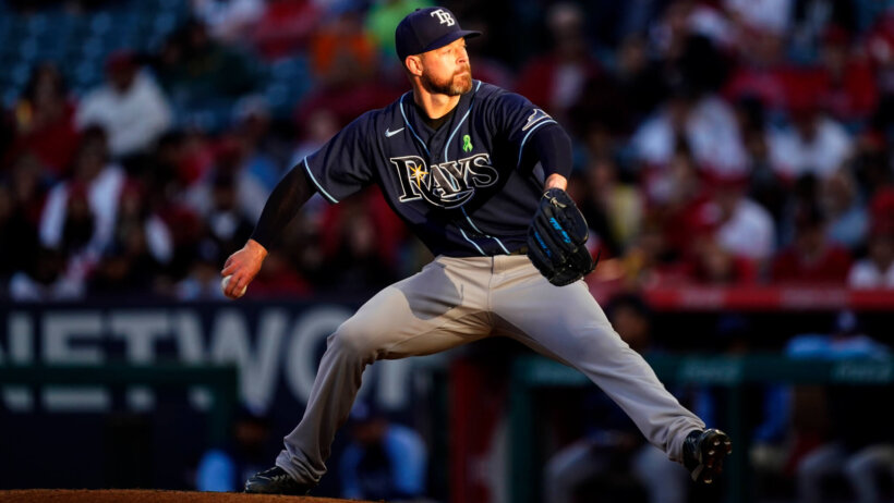 Tampa Bay Rays starting pitcher Corey Kluber mid-windup