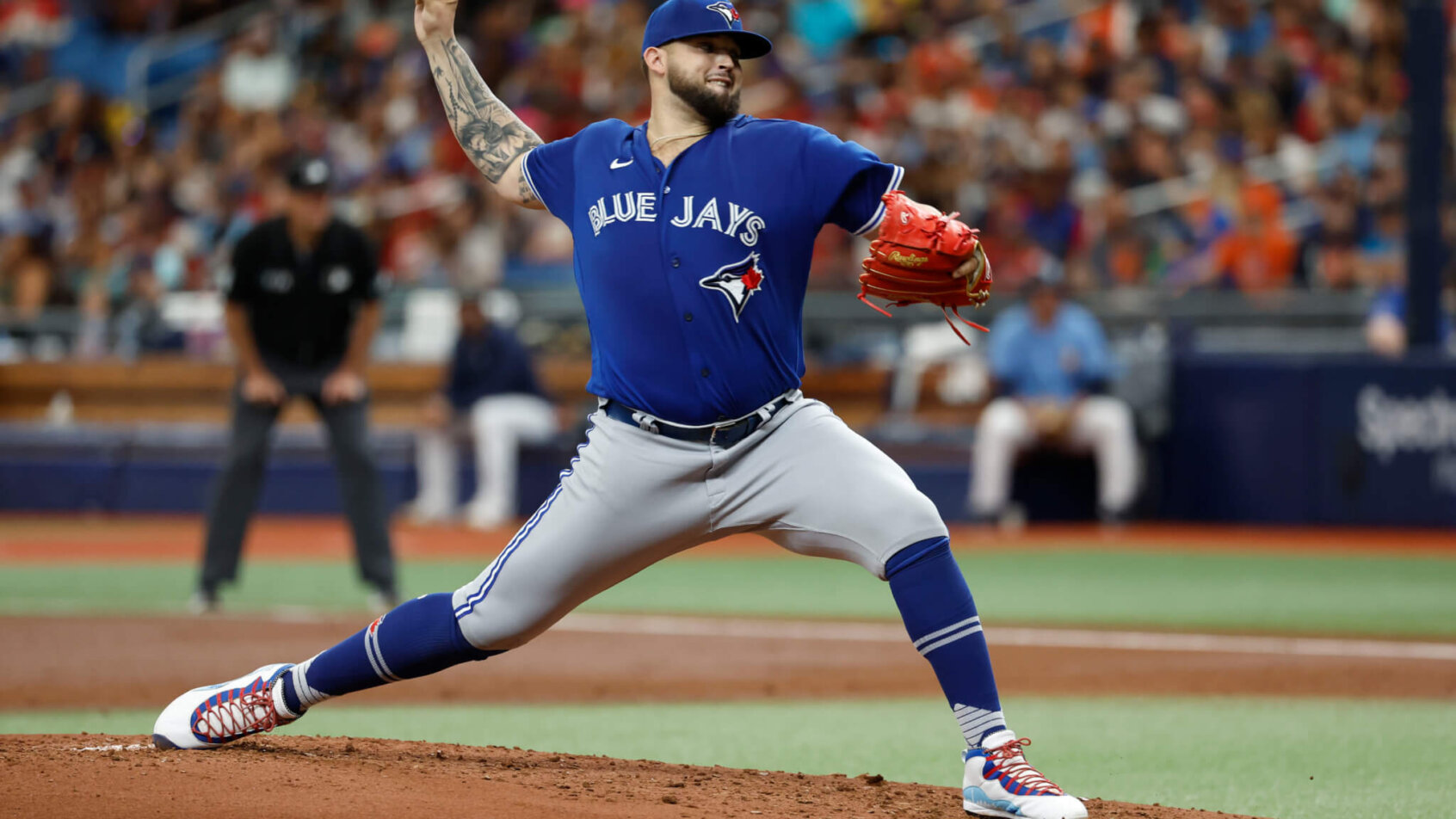 Alek Manoah throwing baseball Blue Jays jersey