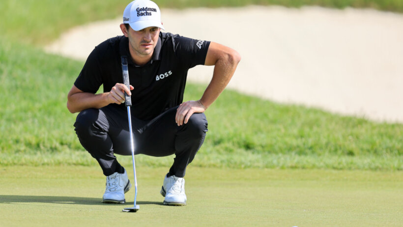 Patrick Cantlay lines up a putt
