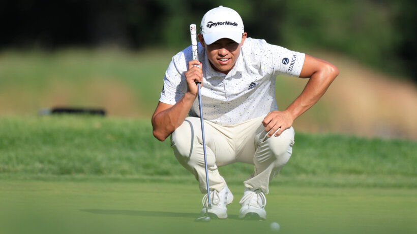 Collin Morikawa lines up a putt; 2022 US Open
