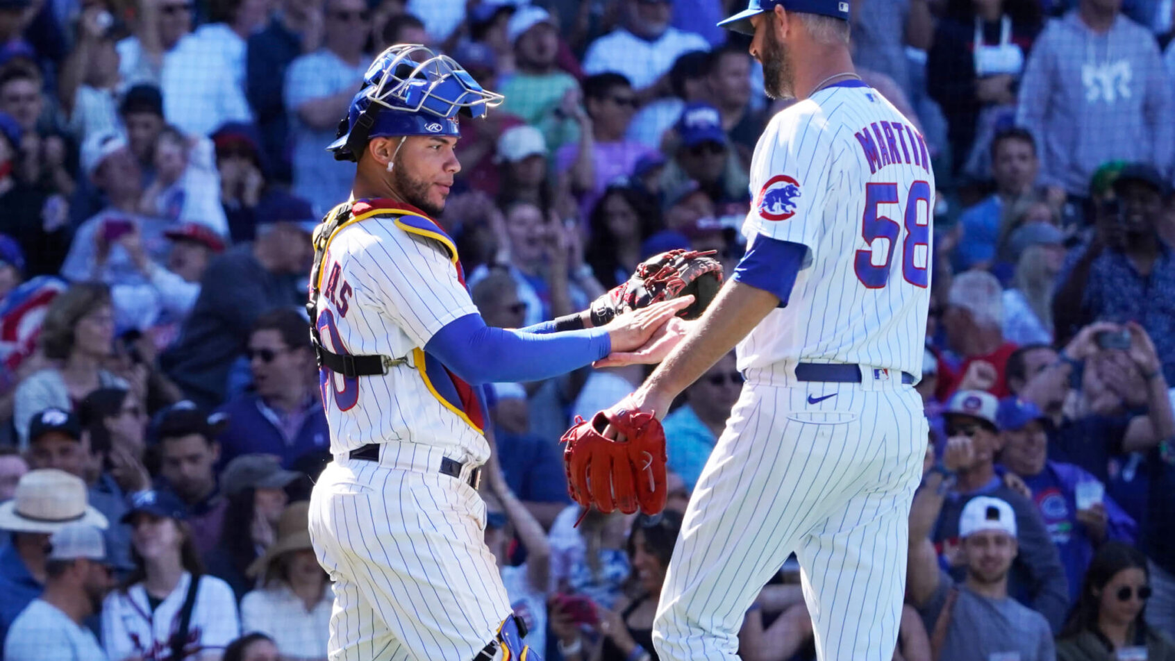 Chicago Cubs catcher Willson Contreras and relief pitcher Chris Martin celebrate a win