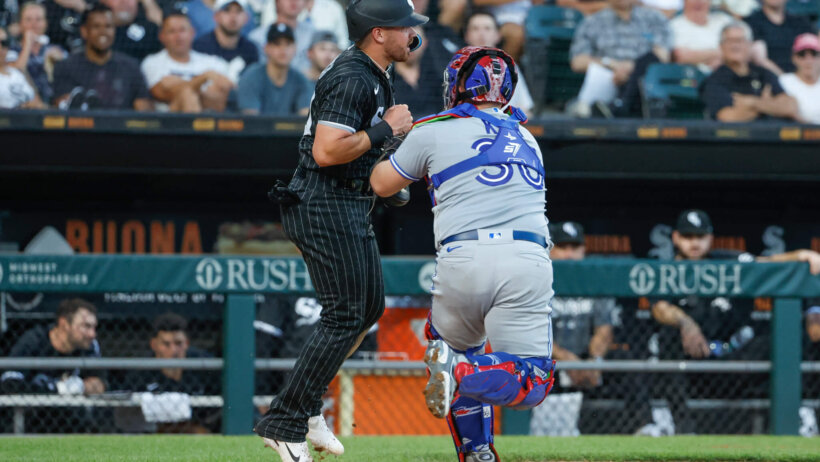 Blue Jays catcher Alejandro Kirk tags out Chicago White Sox second baseman Danny Mendick