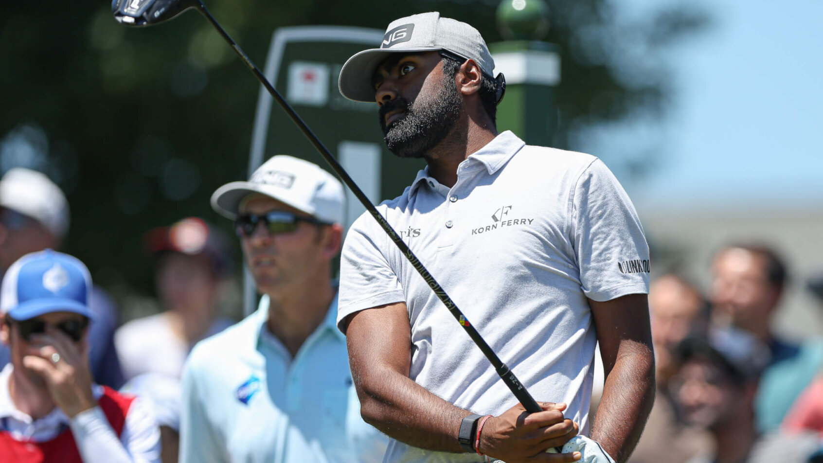 Sahith Theegala watches a tee shot