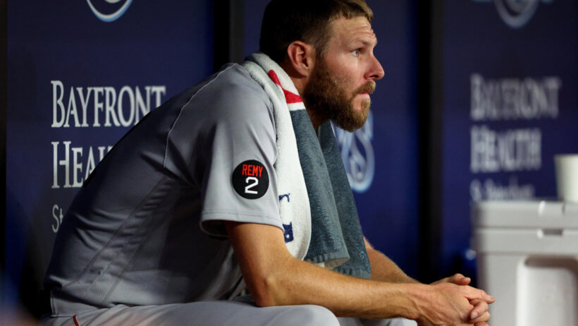 Chris Sale looks on from the bench