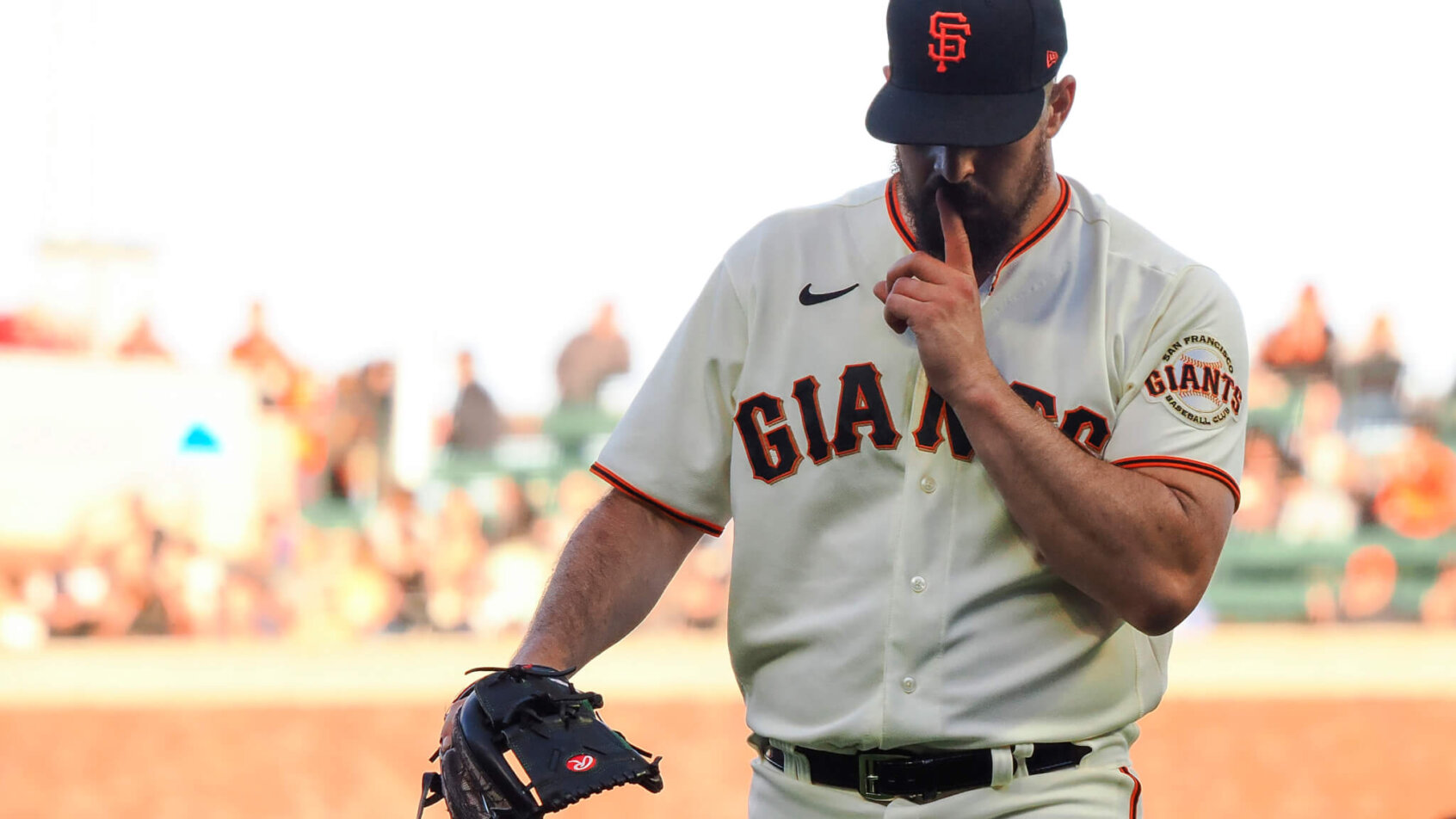 Giants starting pitcher Carlos Rodon quieting the crowd