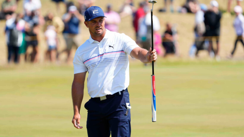 Bryson DeChambeau celebrates after making a putt