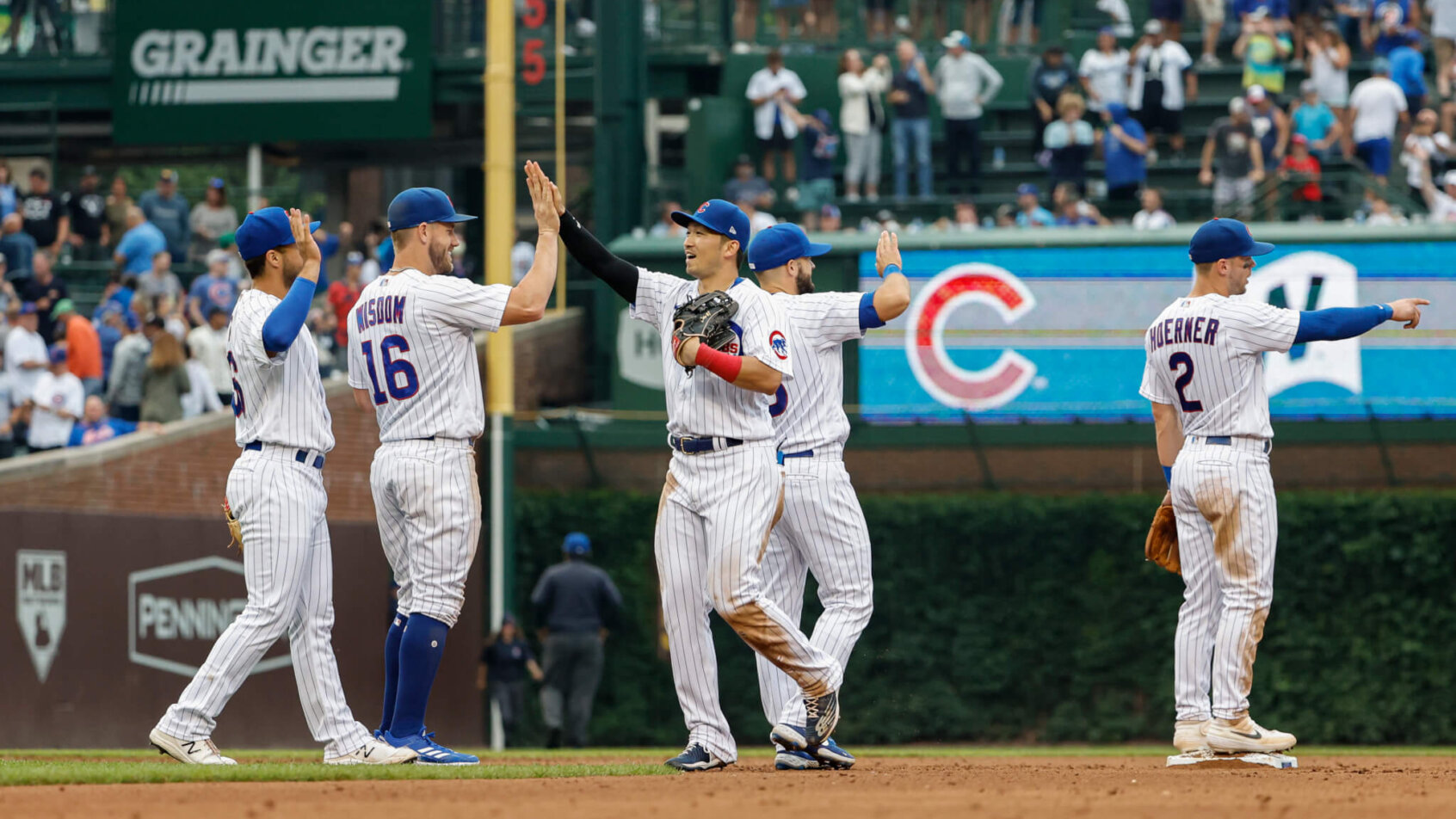 Cubs players celebrate after a win.