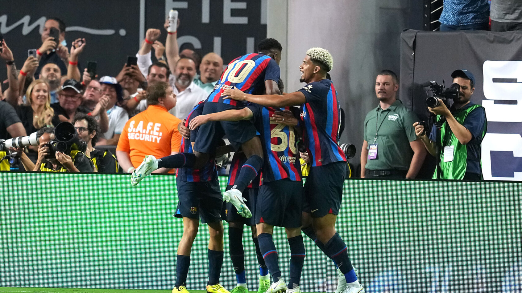 Barcelona players celebrate a goal