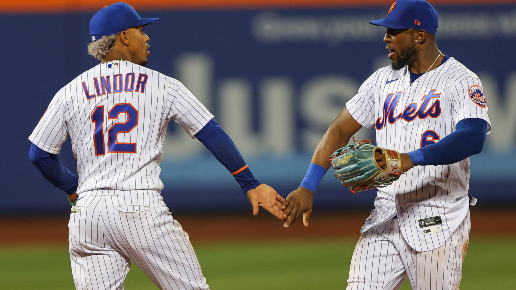Mets players Lindor and Marte celebrate.