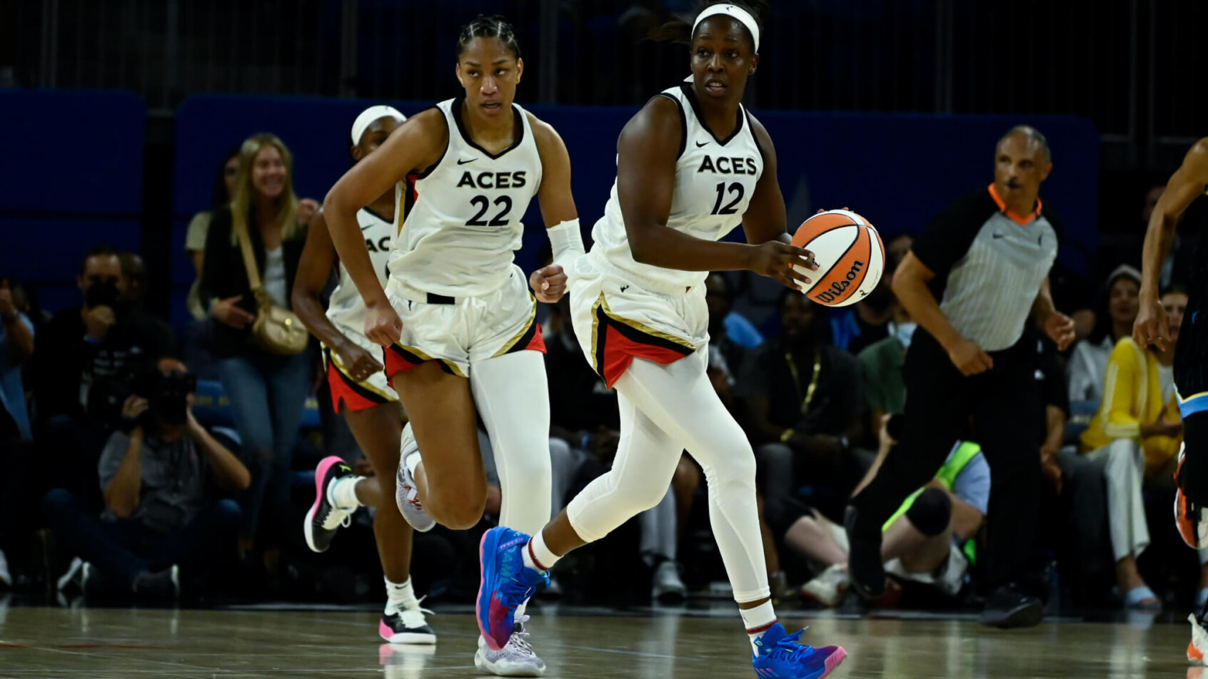 Chelsea Gray moves the ball with A'ja Wilson running the floor