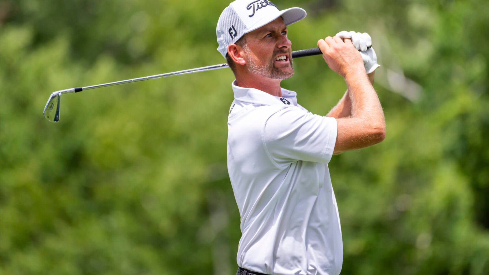 Webb Simpson watching a tee shot