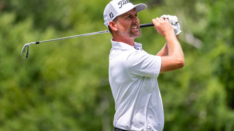 Webb Simpson watching a tee shot