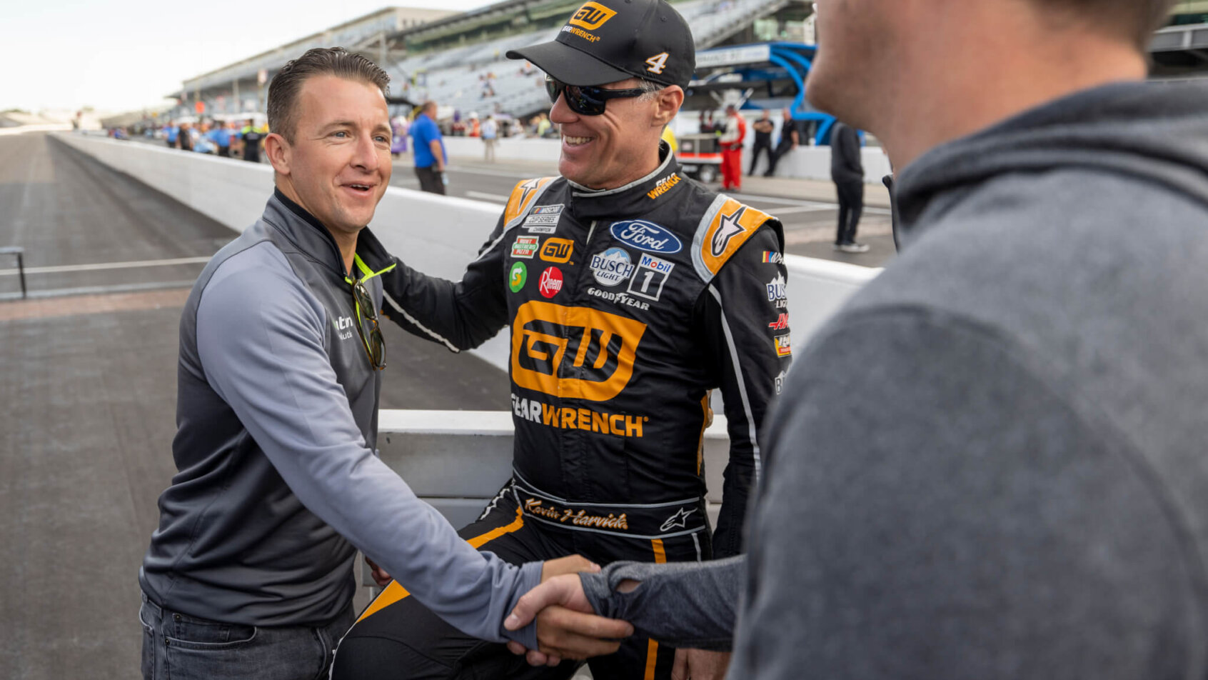AJ Allmendinger, Kevin Harvick and Kyle Busch shaking hands