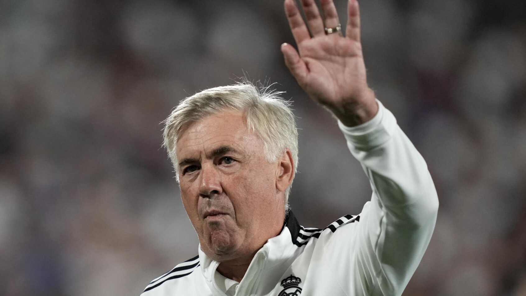 Real Madrid coach Carlo Ancelotti waves to the crowd