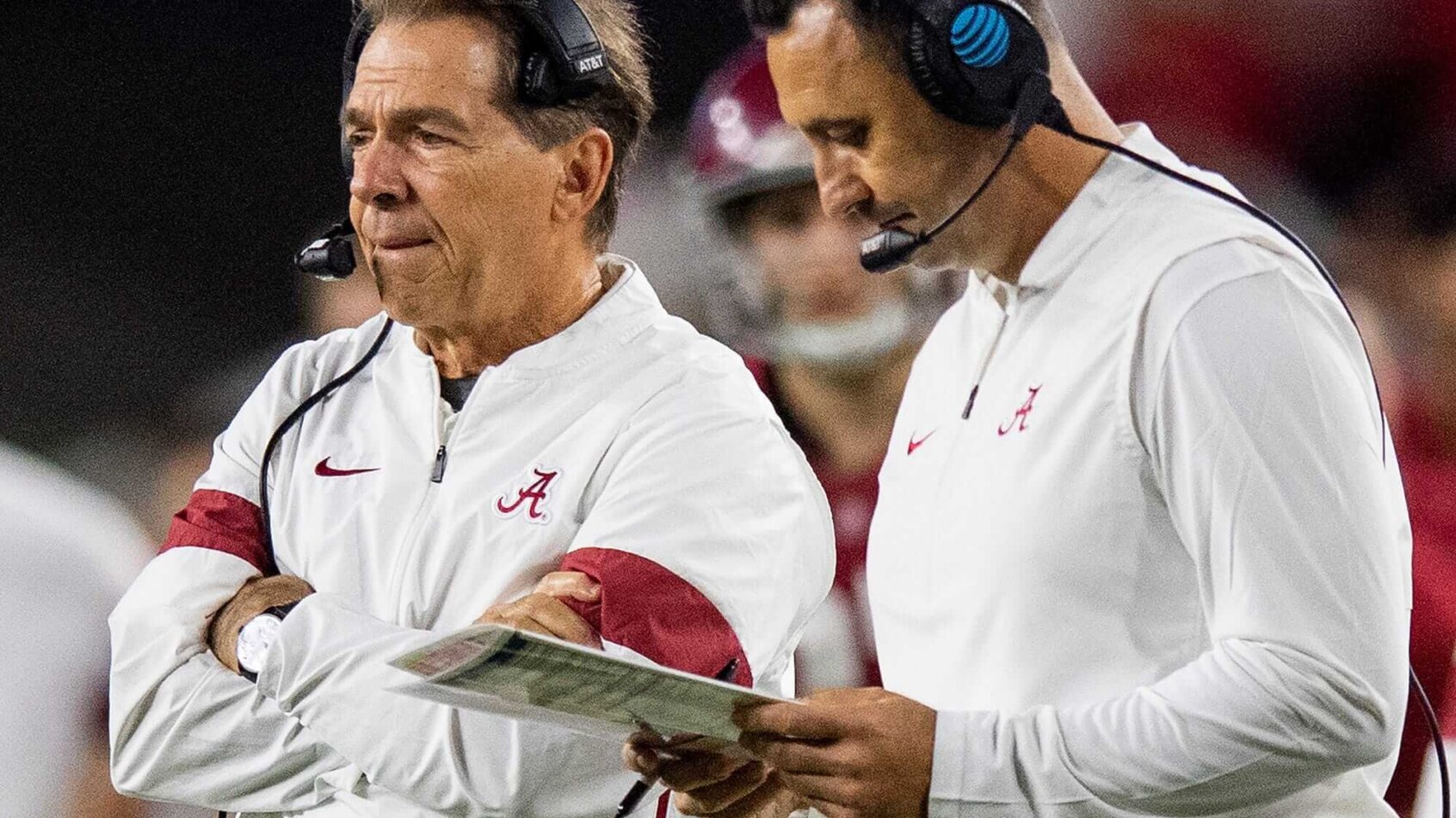 Alabama head coach Nick Saban and then-offensive coordinator Steve Sarkisian confer on the sideline