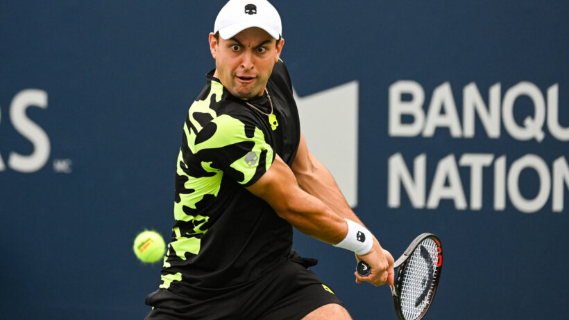 Aslan Karatsev eyes a return volley. He's facing Jan-Lennard Struff in the Madrid Open semifinals.