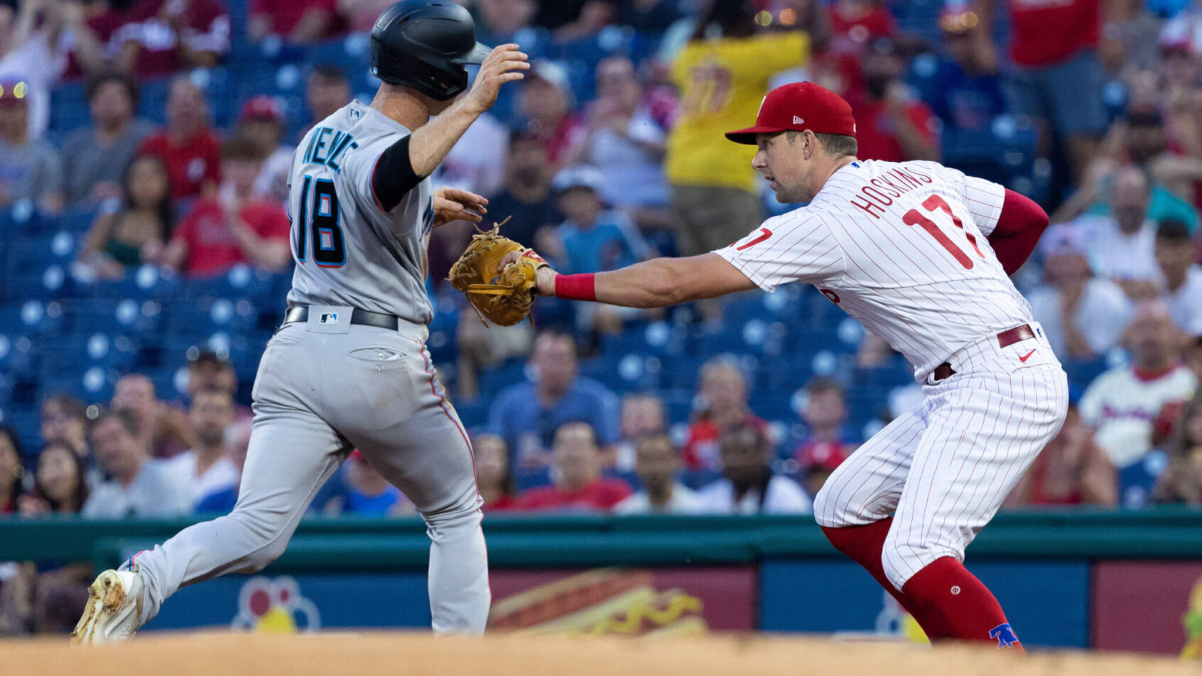 Philadelphia Phillies first baseman Rhys Hoskins tags Miami Marlins second baseman Joey Wendle out at first base