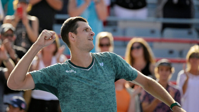 Hubert Hurkacz celebrating after winning a match.