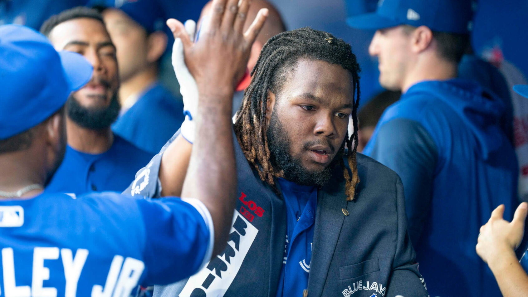 Blue Jays players celebrating together.