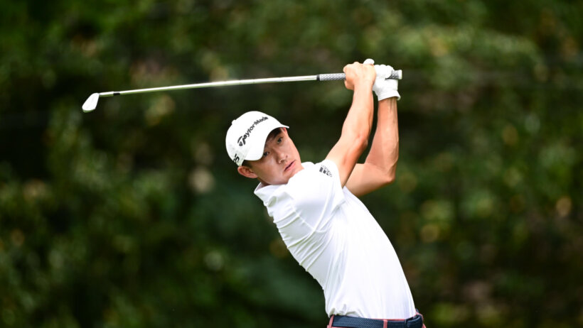 Collin Morikawa hitting a tee shot