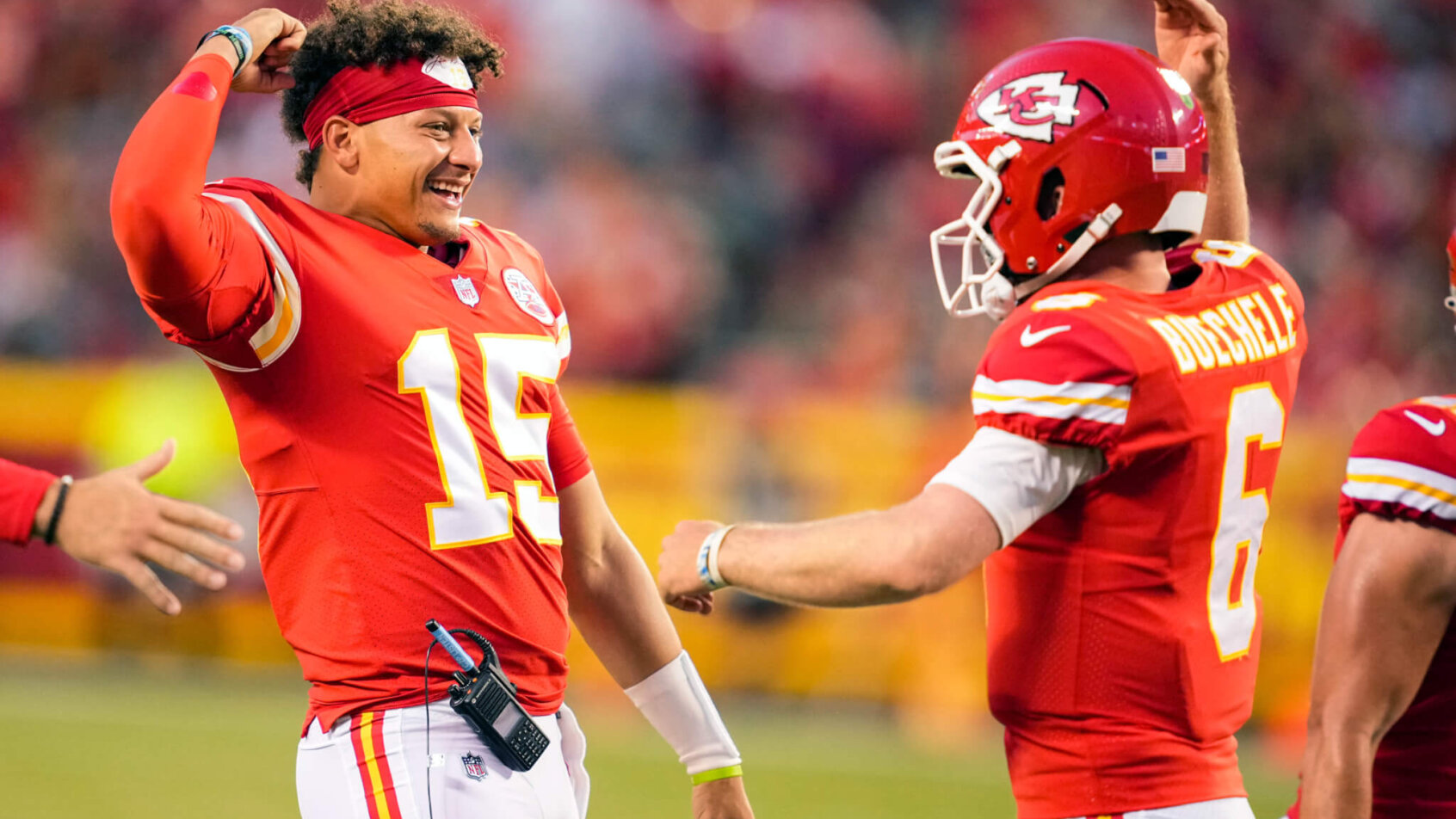 Kansas City Chiefs Patrick Mahomes flexing red jersey