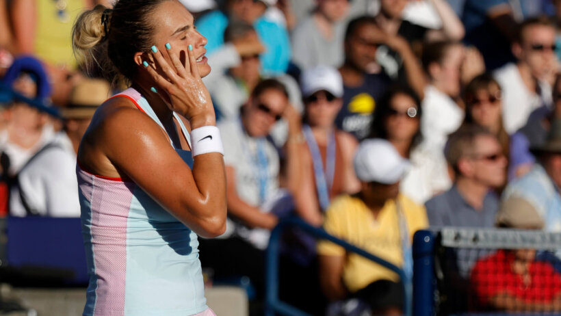 Aryna Sabalenka reacting after missing a shot.