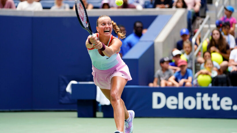 Petra Kvitova stretching to hit a backhand