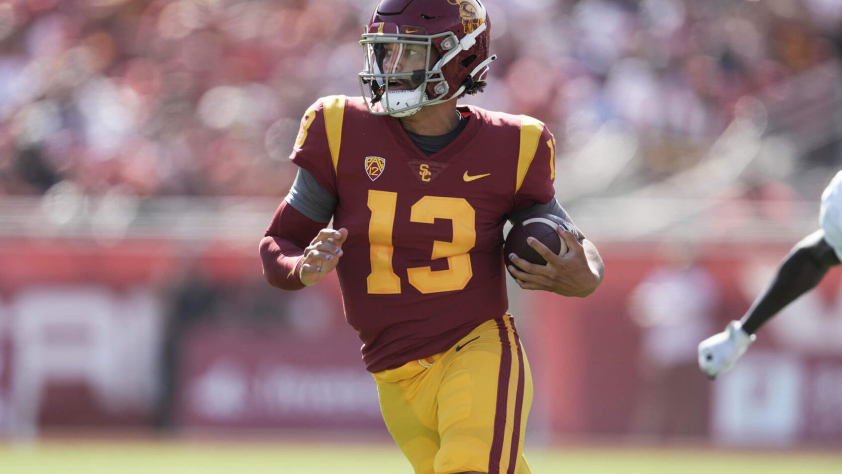 USC Trojans quarterback Caleb Williams carries the ball