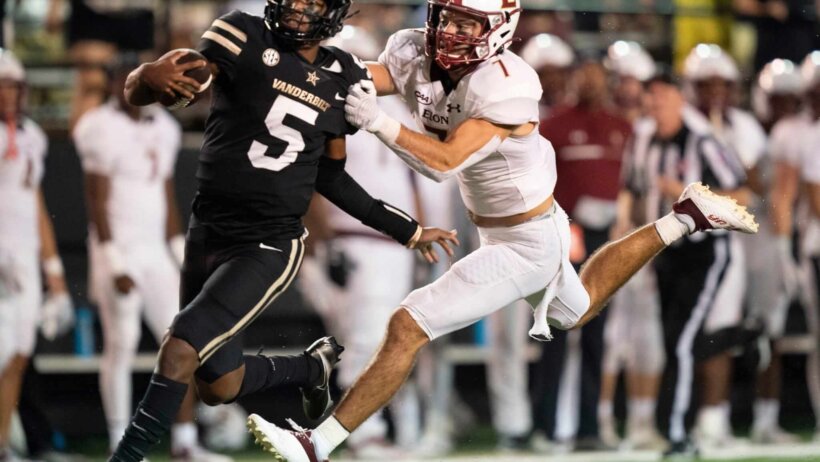 Vanderbilt quarterback Mike Wright races with the football