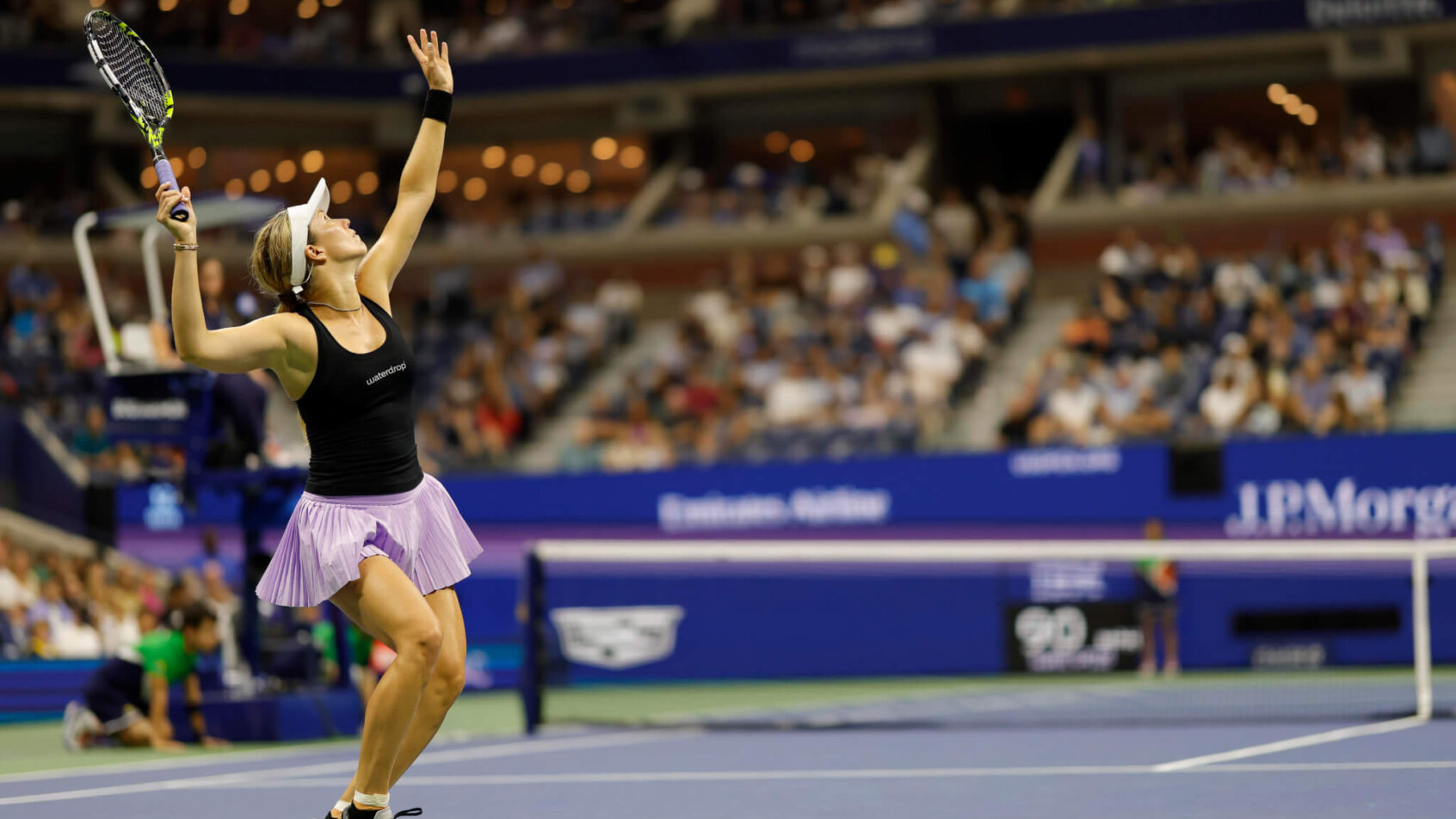 Danielle Collins serving during a tennis match.