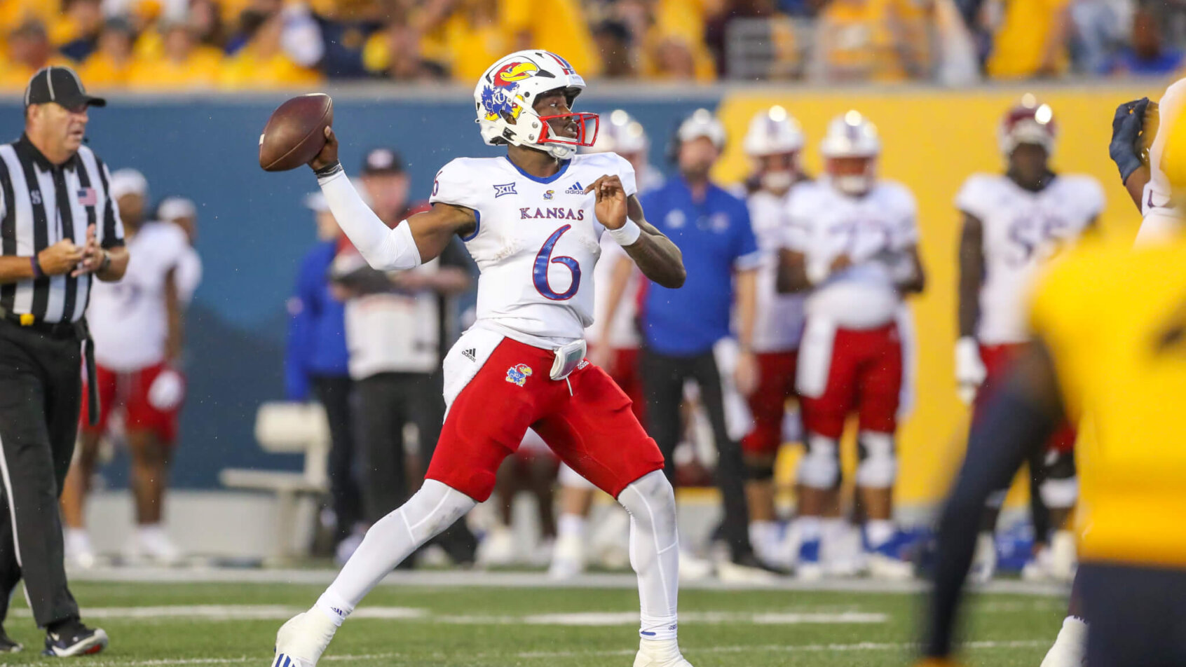 Kansas Jayhawks quarterback Jalon Daniels passes the ball