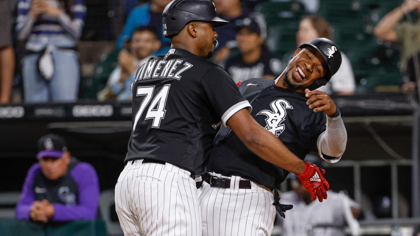Eloy Jimenez and Elvis Andrus celebrate a home run