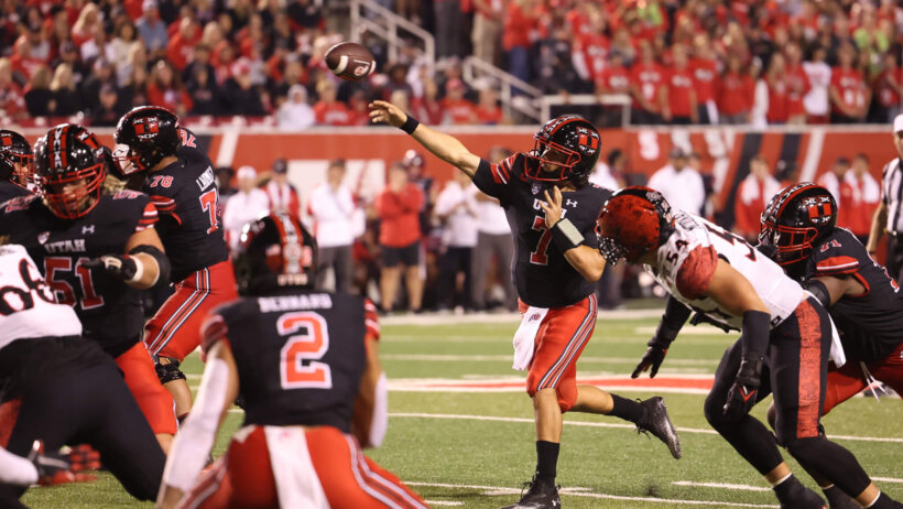 Utah Utes quarterback Cameron Rising throws the ball