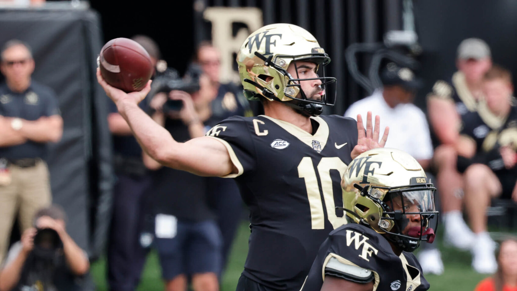 Wake Forest Demon Deacons quarterback Sam Hartman throws a pass